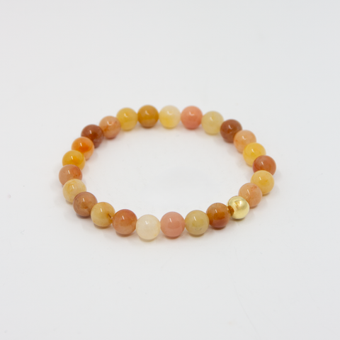 Stenarmbånd Oransje Jade Forgylt Kule 8mm fra Norway Designs
